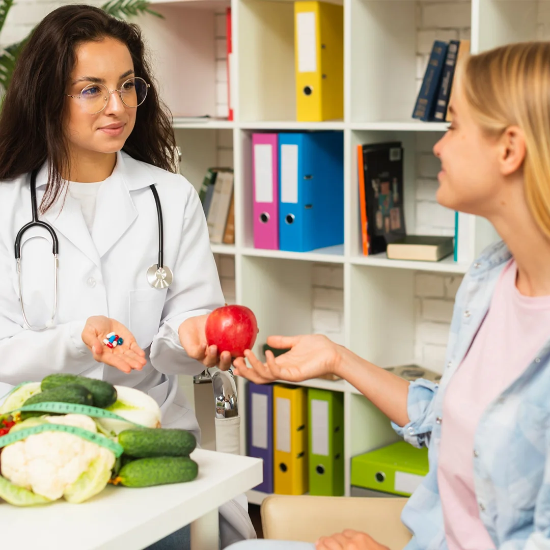 Doctor discussing nutrition choices with patient using pills and fresh vegetables.
