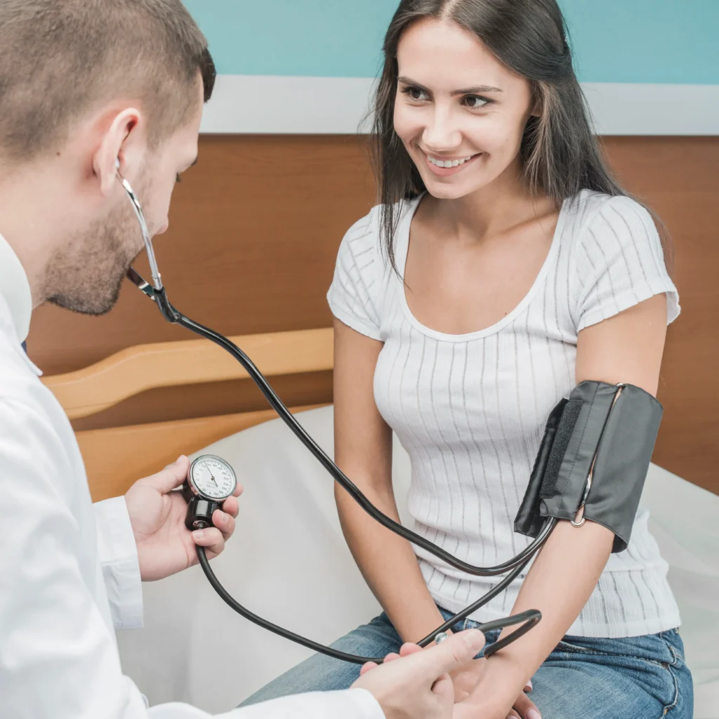 Doctor measuring patient’s blood pressure